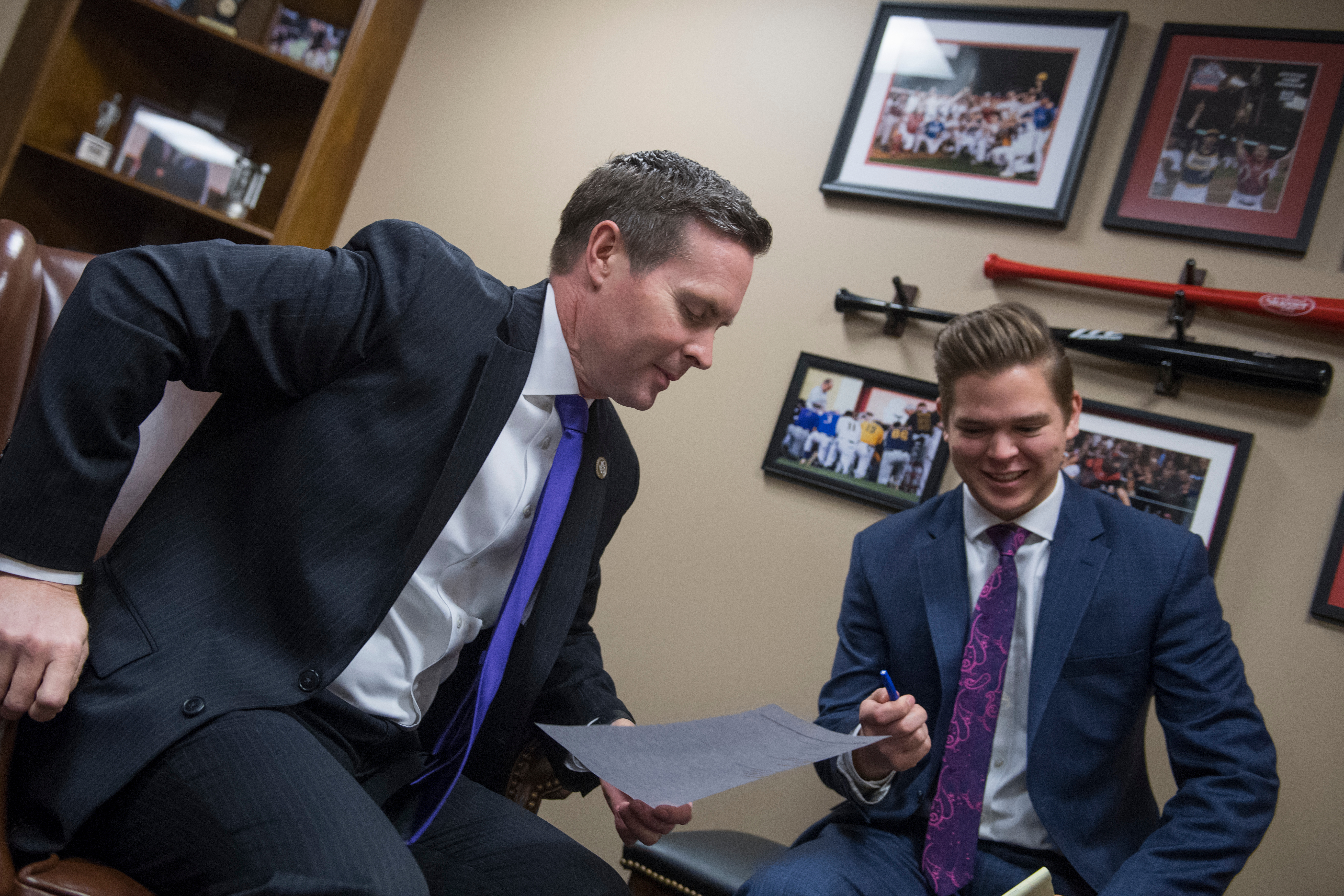 UNITED STATES - FEBRUARY 06: Rep. Rodney Davis, R-Ill., left, and his legislative correspondent David Ross, are seen in their Longworth Building office on February 6, 2018. (Photo By Tom Williams/CQ Roll Call)
