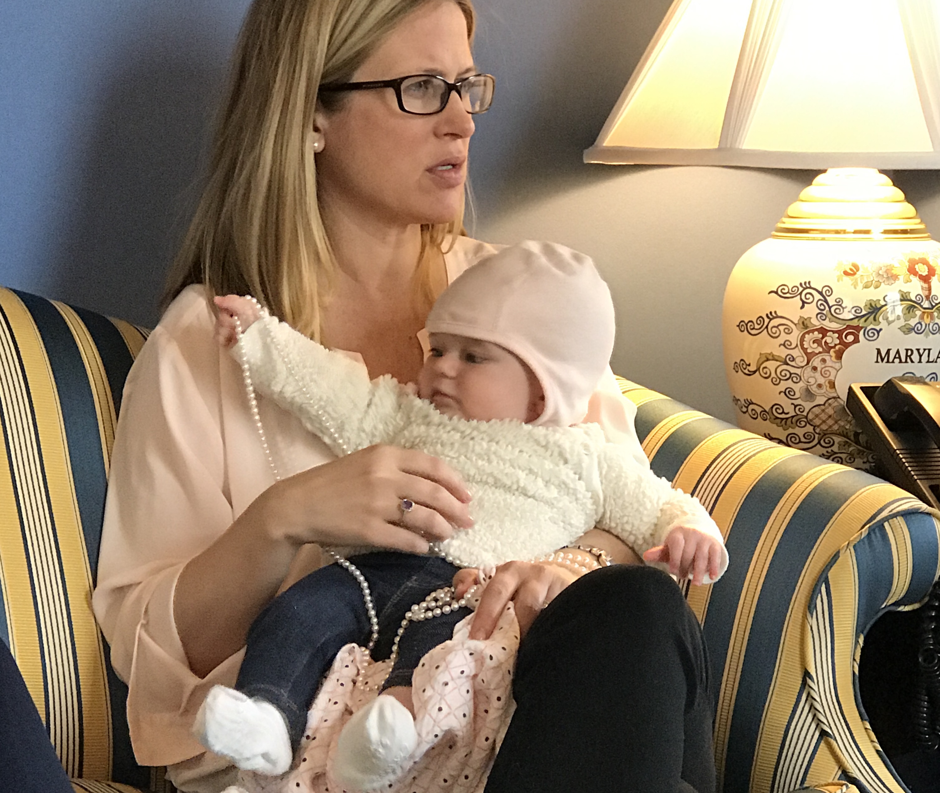Alexis Covey-Brandt runs a staff meeting while holding her daughter, Ellie. (Courtesy of Hoyer's office)