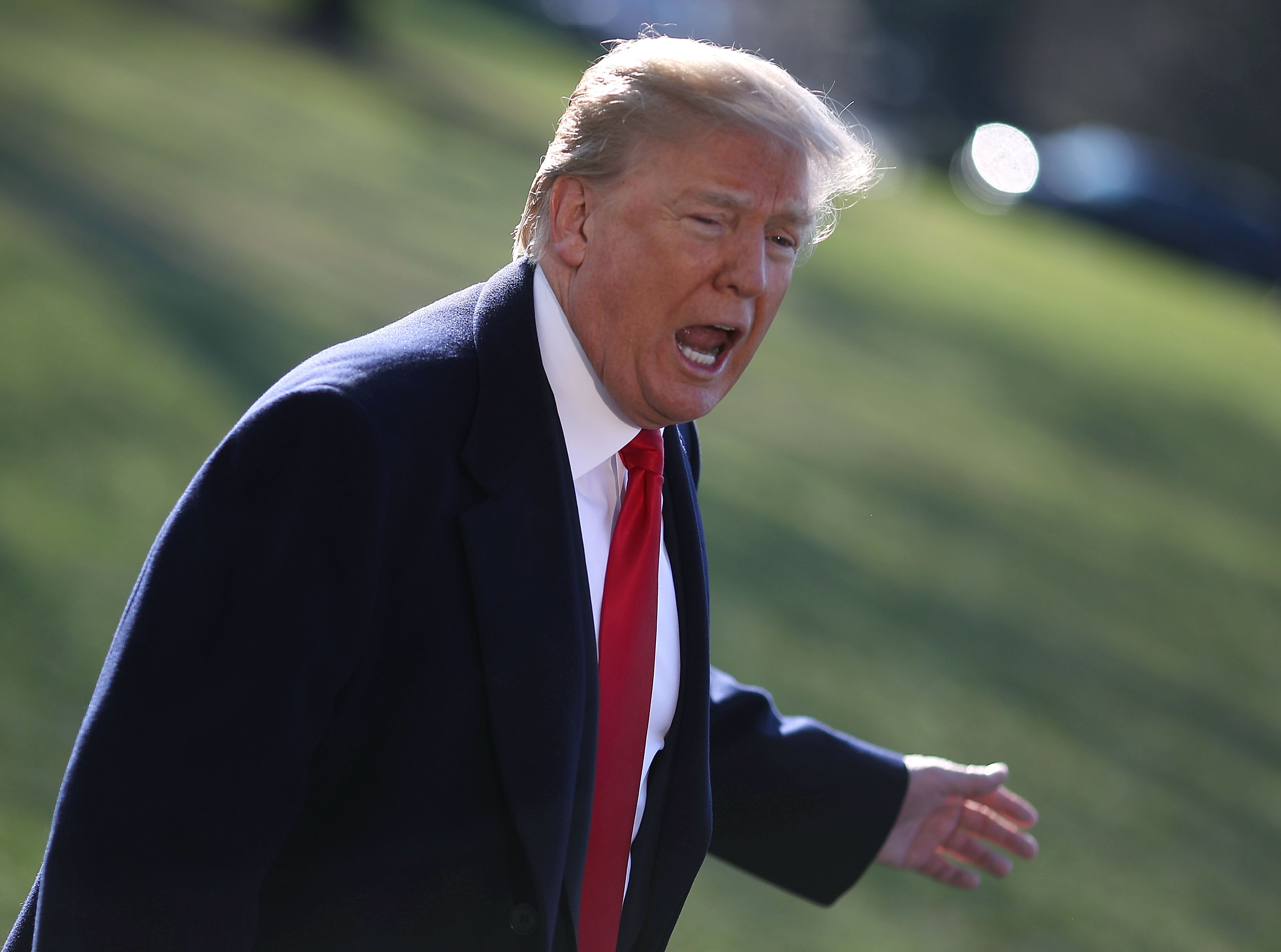 President Donald Trump answers questions from the media on March 13 before heading to California to view prototypes of his proposed Southern border wall. He said Monday the barrier would “keep the damn drugs out.” (Mark Wilson/Getty Images)