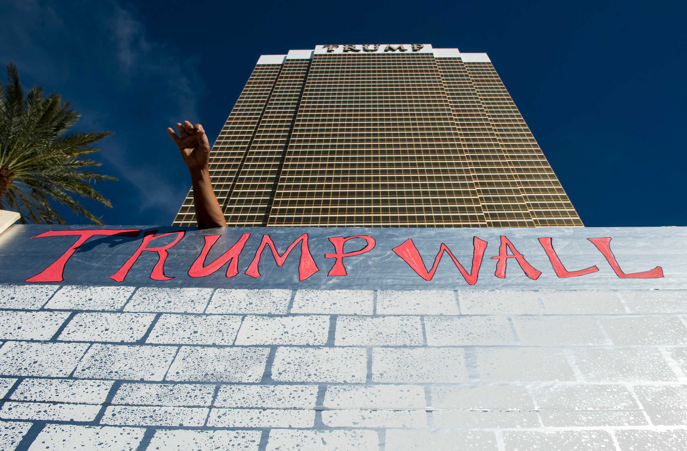 UNITED STATES - OCTOBER 19: Protesters erect a cardboard wall in front of the Trump International Hotel Las Vegas during the Culinary Union's Wall of Taco Trucks protest the day of the final Presidential debate in Las Vegas on Oct. 19, 2016. (Photo By Bill Clark/CQ Roll Call)
