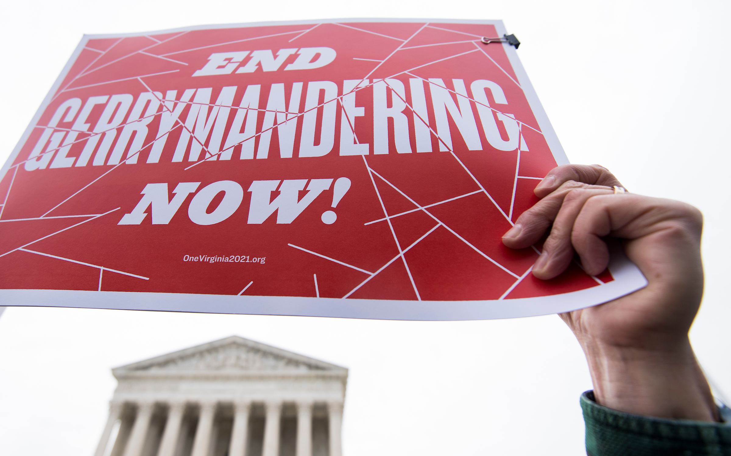 Anti-gerrymandering activists gather on the steps of the Supreme Court as it prepares to hear a case Wednesday that challenged the drawing of a Maryland congressional district. (Bill Clark/CQ Roll Call)