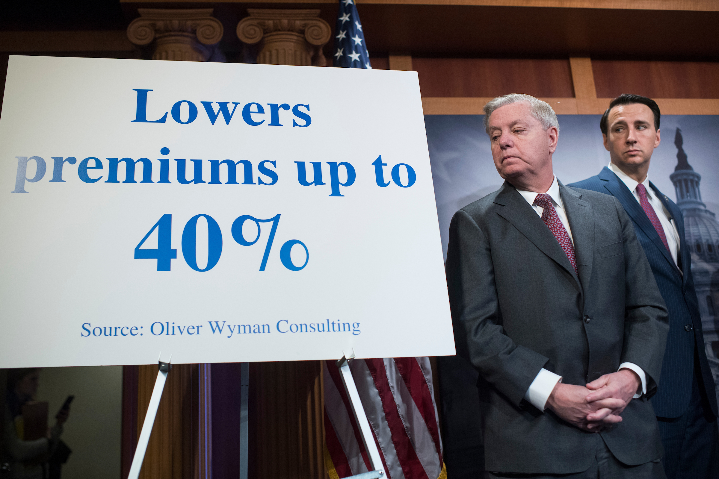 Sen. Lindsey Graham, R-S.C., left, and Rep. Ryan Costello, R-Pa., conduct a news conference in the Capitol on legislation to lower health insurance premiums for citizens who pay out of pocket on March 21, 2018. (Tom Williams/CQ Roll Call)