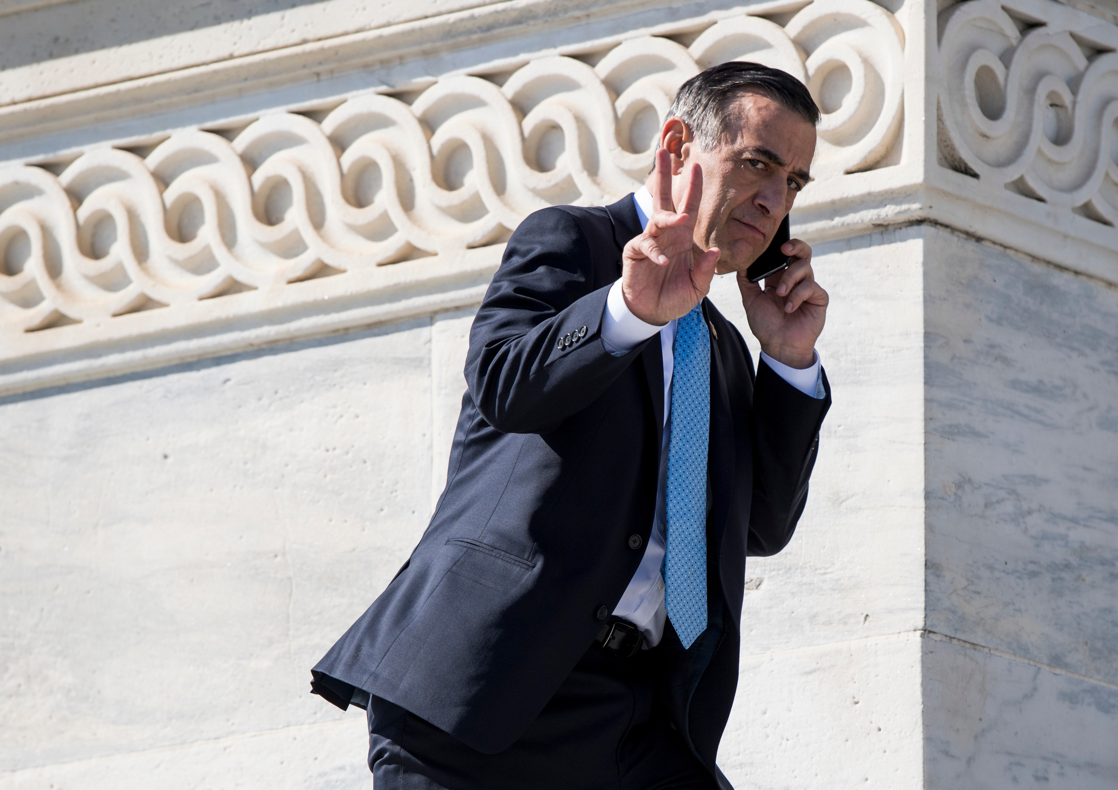 Rep. Darrell Issa, R-Calif., walks up the House steps for final votes of the week in the Capitol on Thursday. (Bill Clark/CQ Roll Call)