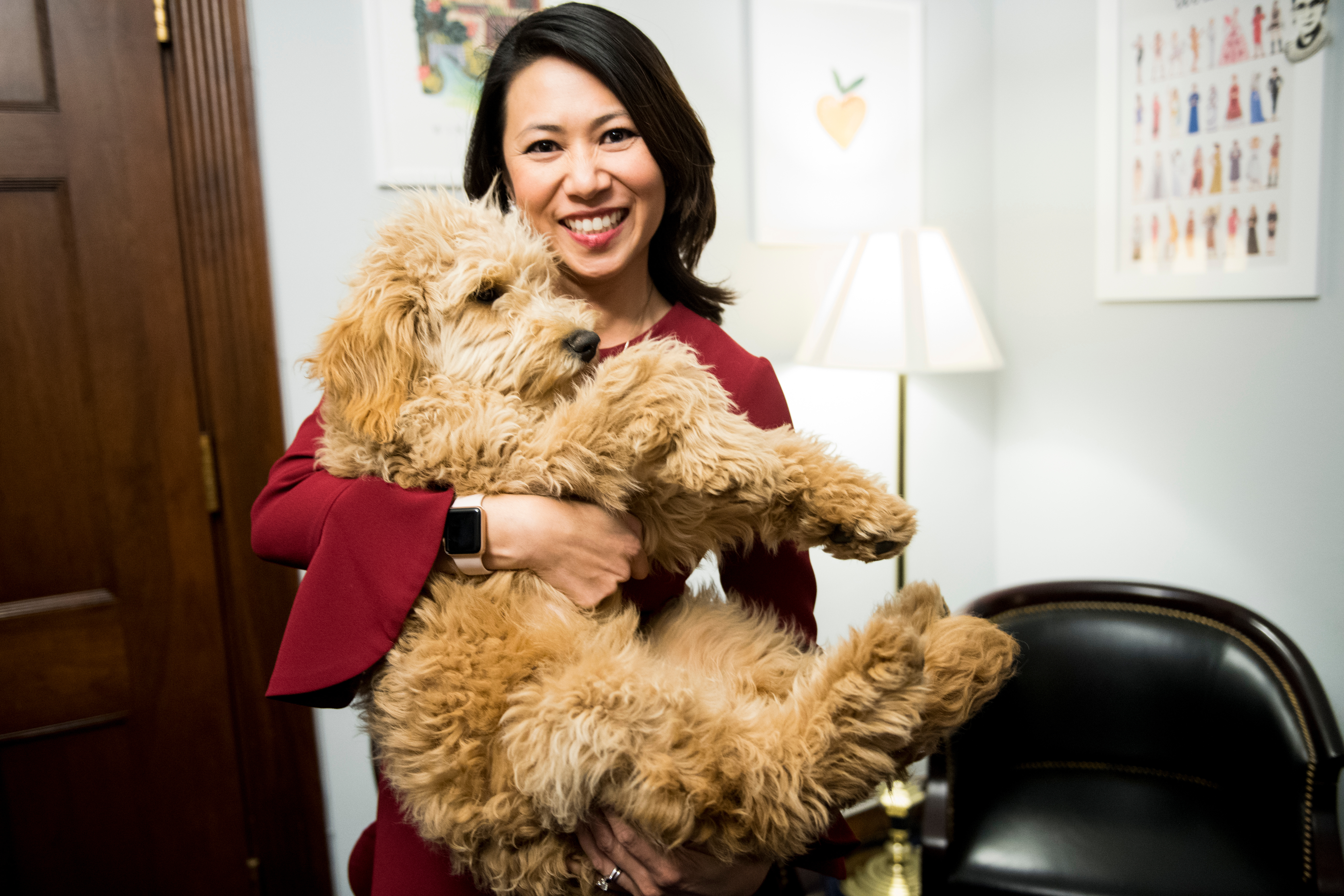 UNITED STATES - MARCH 6: Rep. Stephanie Murphy, D-Fla., poses with her office's chief morale officer Carmela on Tuesday, March 6, 2018. (Photo By Bill Clark/CQ Roll Call)