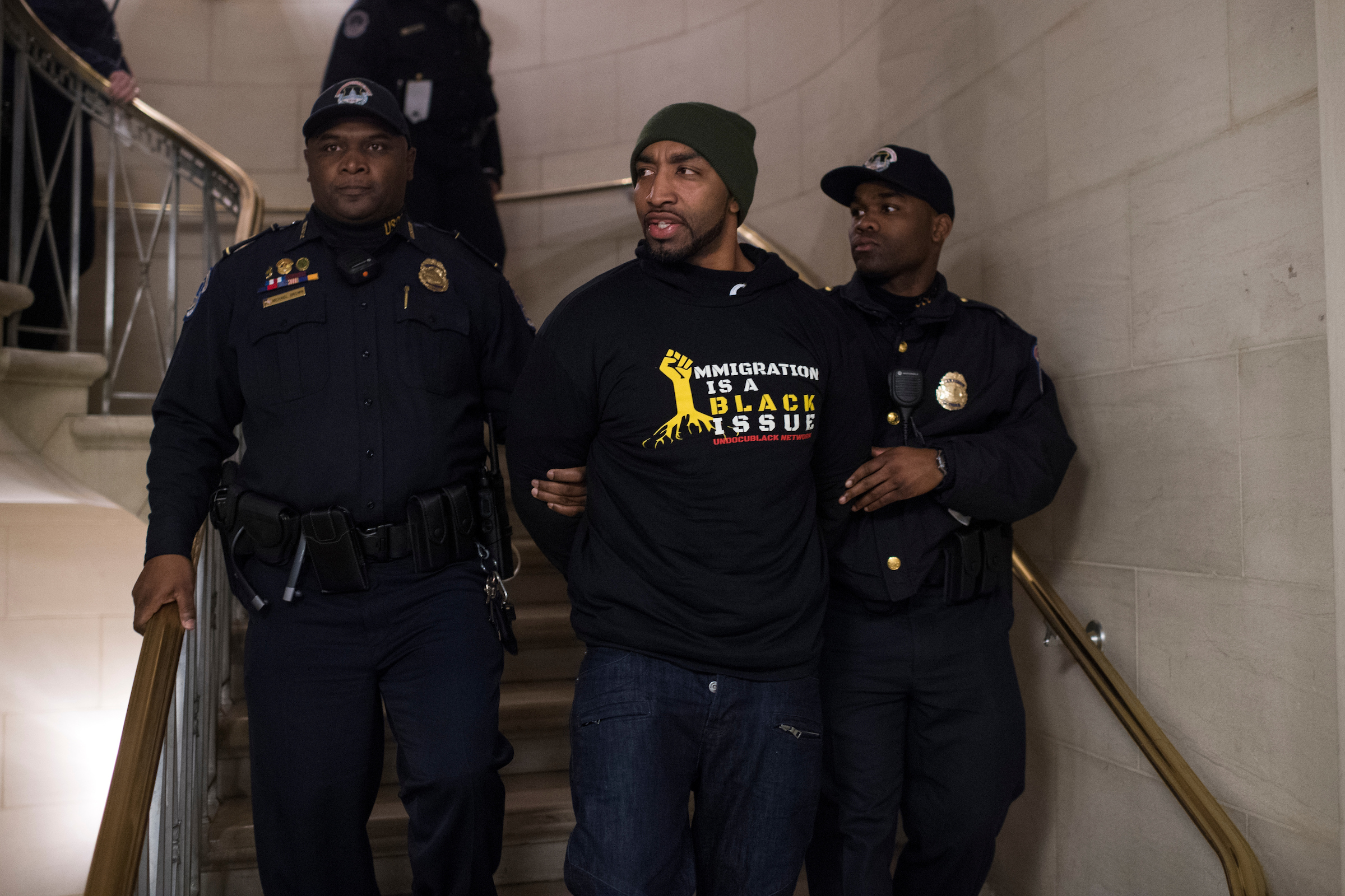 UNITED STATES - FEBRUARY 27: A protester is arrested near the Longworth Building office of Speaker Paul Ryan, R-Wis., while calling for passage of a clean Dream Act on behalf a undocumented black immigrants on February 27, 2018. (Photo By Tom Williams/CQ Roll Call)