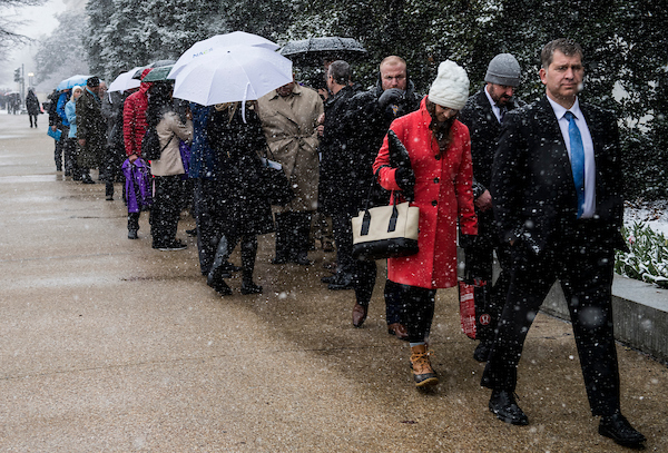 UNITED STATES - MARCH 21: With only two entrances open to the Hart and Dirksen buildings, visitors wait in a long line in the snow to enter the Hart Senate Office Building Wednesday morning, March 21, 2018. (Photo By Bill Clark/CQ Roll Call)