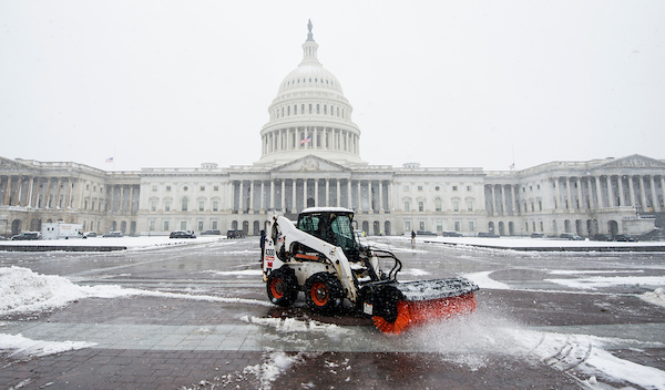 Workers clear the East Plaza of the Capitol on Wednesday. Congress is in session. (Bill Clark/CQ Roll Call)