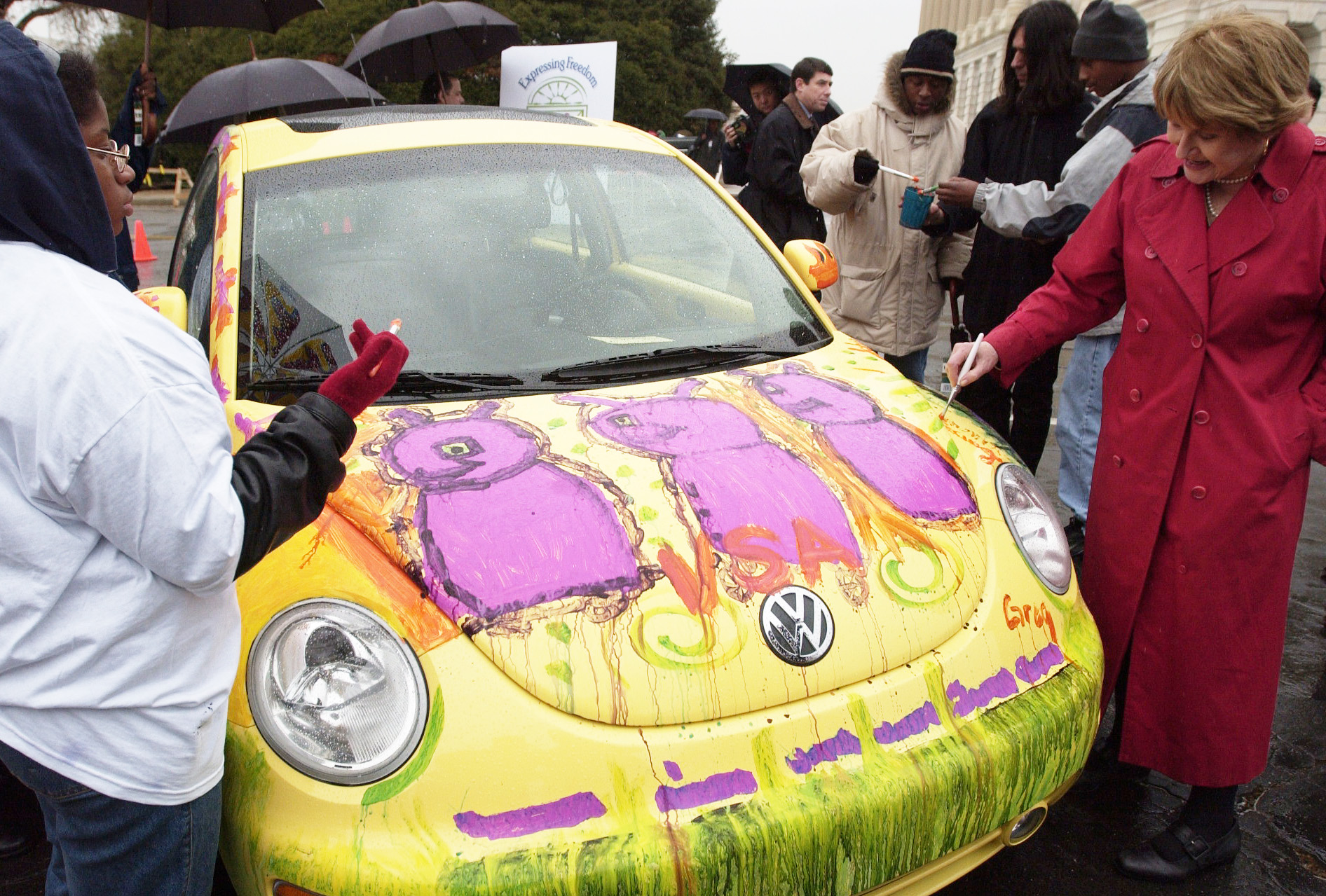 beetle1/031202 - Rep. Louise Slaughter, Co-Chair, Congressional Arts Caucus, paints a VW New Beetle Congressional Arts Caucus before a press conference to launch "Expressing Freedom: A National Juried Art Exhibition for Young Artists with Disabilites," sponsered by VSA Arts and Volkswagen of America, Inc.