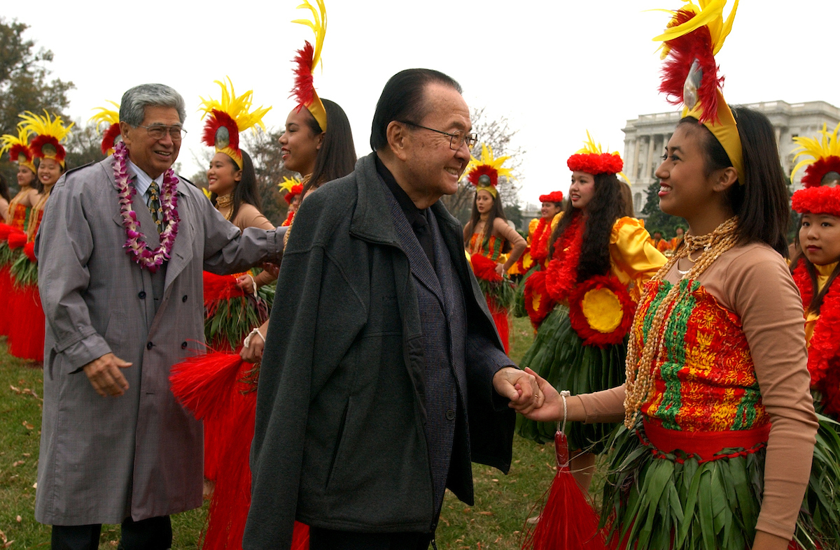 Sens. Daniel Inouye,D-Hawaii, center, and Daniel Akaka, D-D-Hawaii, greet members of the Hawaii All State Marching Band composed of students from 40 high schools and 4 islands from Hawaii, after they performed on the West Front, in preparation for the Macy's Thanksgiving Day Parade, in New York.