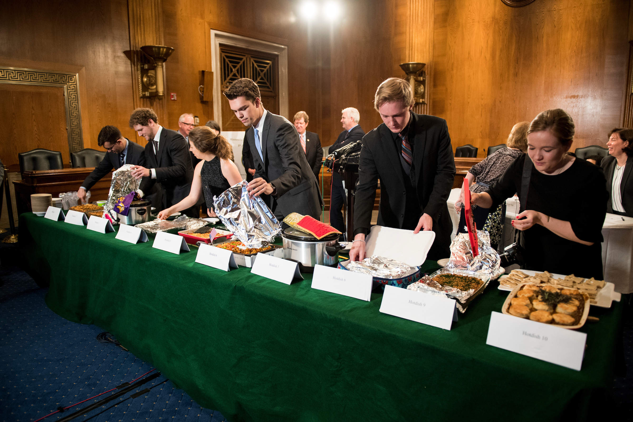 UNITED STATES - APRIL 25: Staffers uncover the dishes during the eighth annual Minnesota Congressional Delegation Hotdish Competition in the Dirksen Senate Office Building on Wednesday, April 25, 2018. (Photo By Bill Clark/CQ Roll Call)