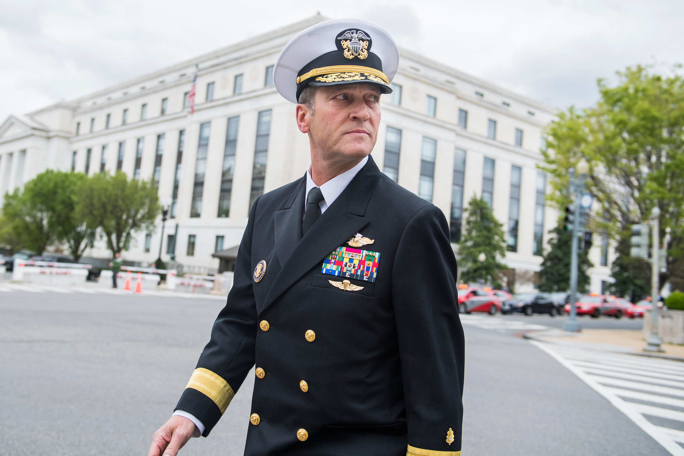 Navy Rear Adm. Ronny Jackson, President Donald Trump’s nominee for Veterans Affairs secretary, leaves the Dirsken Building after a meeting with Kansas GOP Sen. Jerry Moran on Tuesday. (Tom Williams/CQ Roll Call)