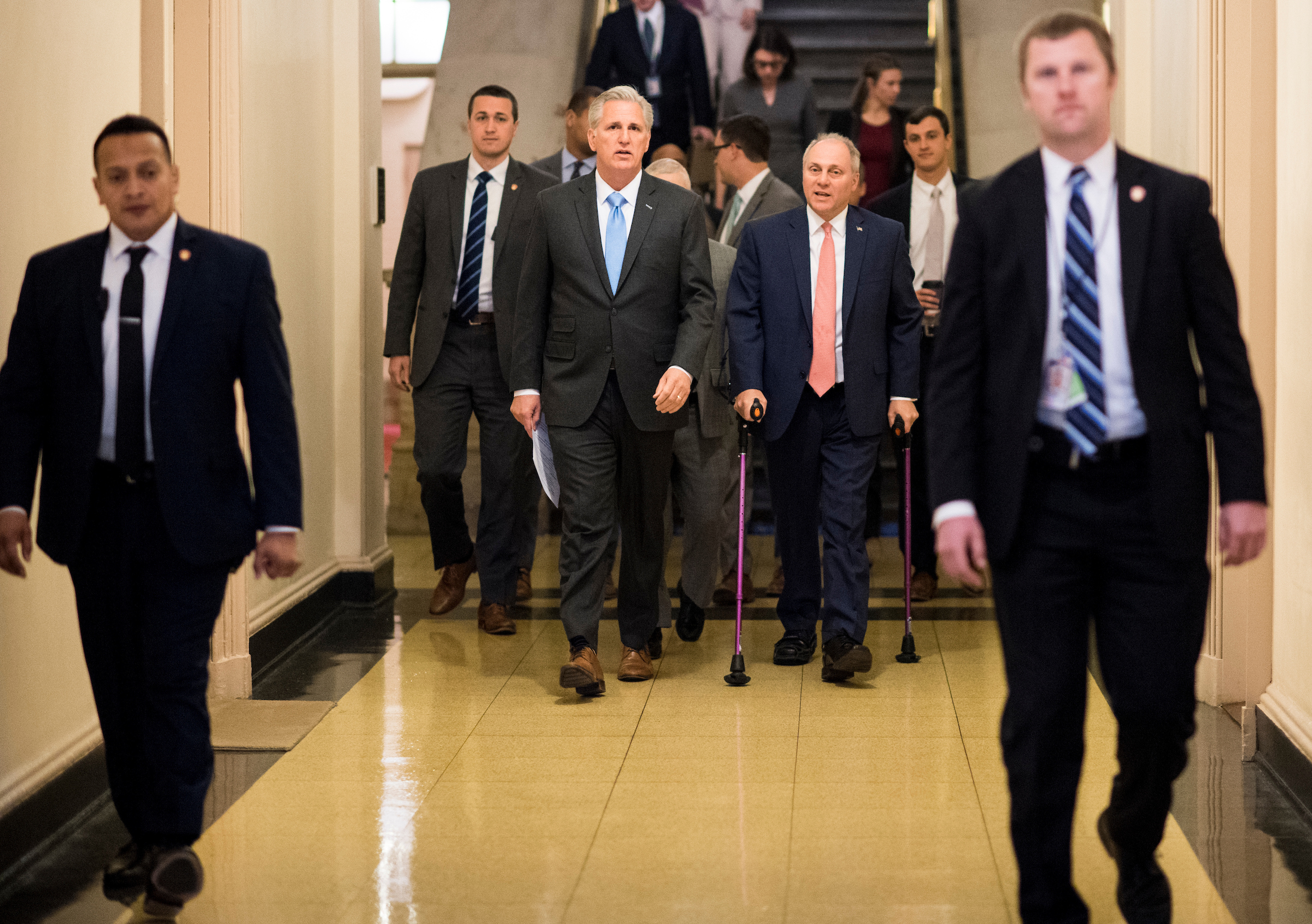 House Majority Leader Kevin McCarthy, R-Calif.,  center left, and House Majority Whip Steve Scalise, R-La., center right, arrive for the House Republican Conference meeting in the basement of the Capitol on Wednesday. (Bill Clark/CQ Roll Call)