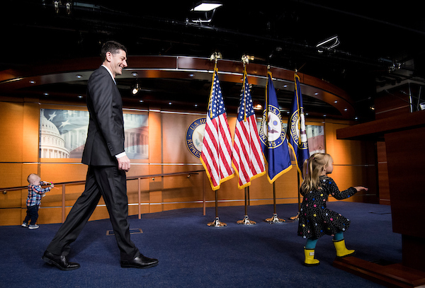 Speaker Paul D. Ryan, R-Wis., arrives to hold his weekly press conference as press offspring play on stage during Take Our Daughters and Sons to Work Day on Thursday. (Bill Clark/CQ Roll Call)