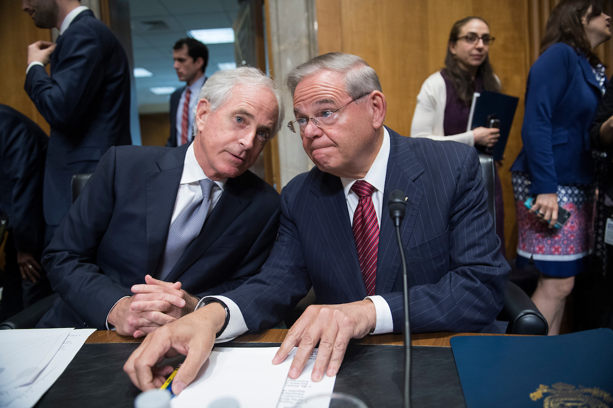 Senate Foreign Relations Chairman Bob Corker, R-Tenn., left, and ranking member Bob Menendez, D-N.J., confer Monday before a tense committee markup on the nomination of Mike Pompeo to be secretary of State. (Tom Williams/CQ Roll Call)