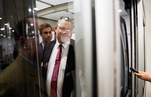 UNITED STATES - APRIL 24: Sen. Jon Tester, D-Mont., speaks with reporters as he boards the Senate subway in the Capitol on Tuesday, April 24, 2018. (Photo By Bill Clark/CQ Roll Call)