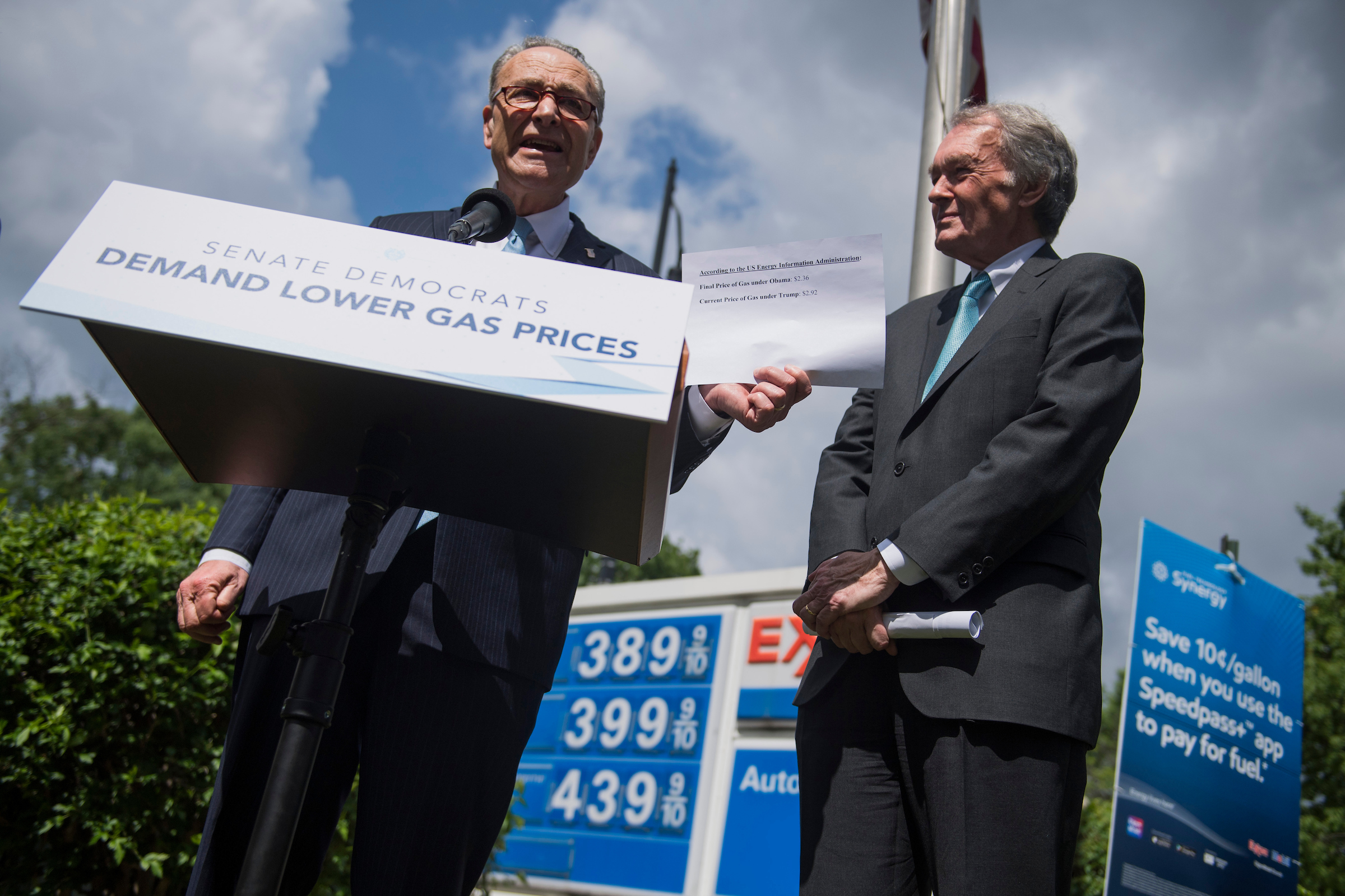 UNITED STATES - MAY 23: Senate Minority Leader Charles Schumer, D-N.Y., left, and Sen. Ed Markey, D-Mass., conduct a news conference at the Exxon gas station at Massachusetts Avenue and 2nd Street, NE, to urge President Trump to take action to lower gas prices on May 23, 2018. Schumer holds a statistic indicating that gas prices were lower under President Obama. (Photo By Tom Williams/CQ Roll Call)