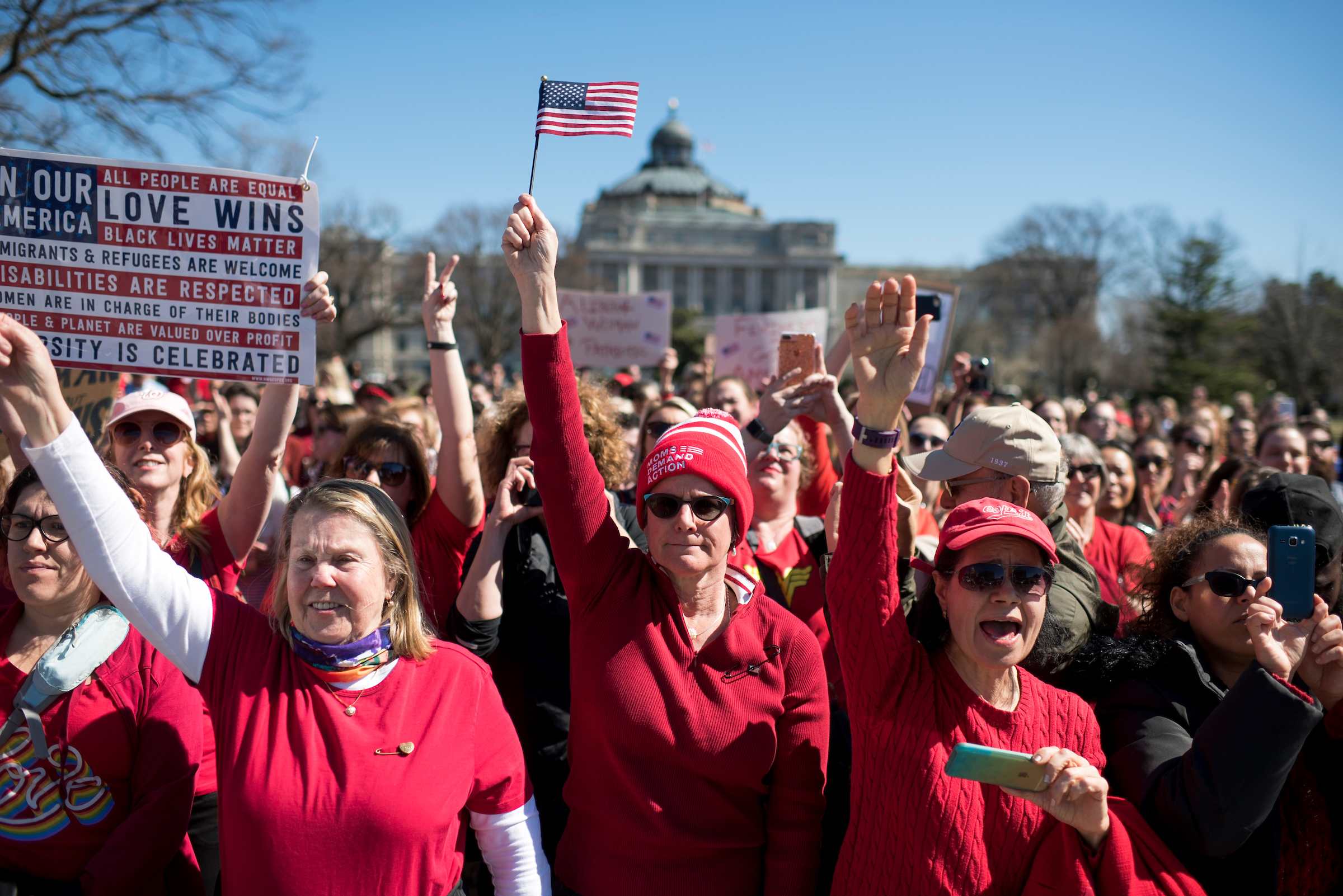 Demonstrators rally outside the Capitol on March 8, 2017, in support of “A Day Without a Woman” protests across the country to coincide with International Women’s Day. There has been a surge in female donors to federal candidates this election cycle. (Tom Williams/CQ Roll Call file photos)