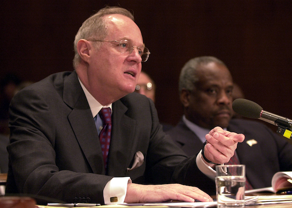 3budget030502 -- Supreme Court Associate Justice Anthony Kennedy describes to Sen. Ernest F. Hollings (R-NC) the Supreme Courts proposed budget, during a Commerce, Justice, State and the Judiciary Subcommittee Hearing on Tuesday morning. To Kennedy's left is Supreme Court Associate Justice Clarence Thomas.