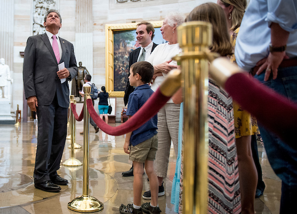 Sen. Joe Manchin, R-Wa.V., speaks to tourists while showing his grandson around the Capitol Thursday June 21, 2018. (Photo By Sarah Silbiger/CQ Roll Call)