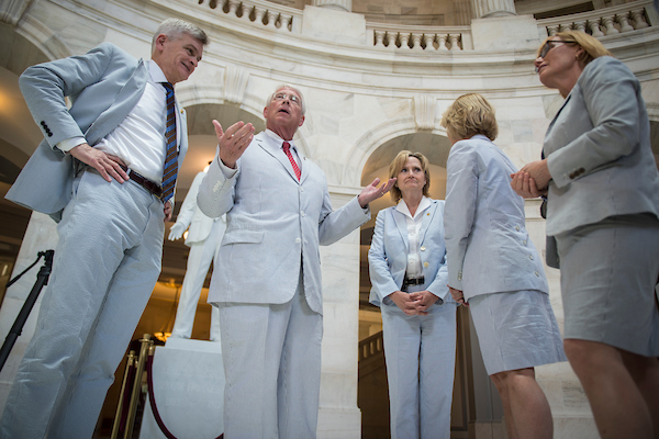 Senators Bill Cassidy, R-La., Roger Wicker, R-Miss., Cindy Hyde-Smith, R-Miss., Shelley Moore, R-W.Va., and Maggie Hassan, D-N.H., gather for a photo on Seersucker Thursday in the Russell Senate Office Building rotunda to celebrate National Seersucker Day June 7, 2018. (Photo By Sarah Silbiger/CQ Roll Call)