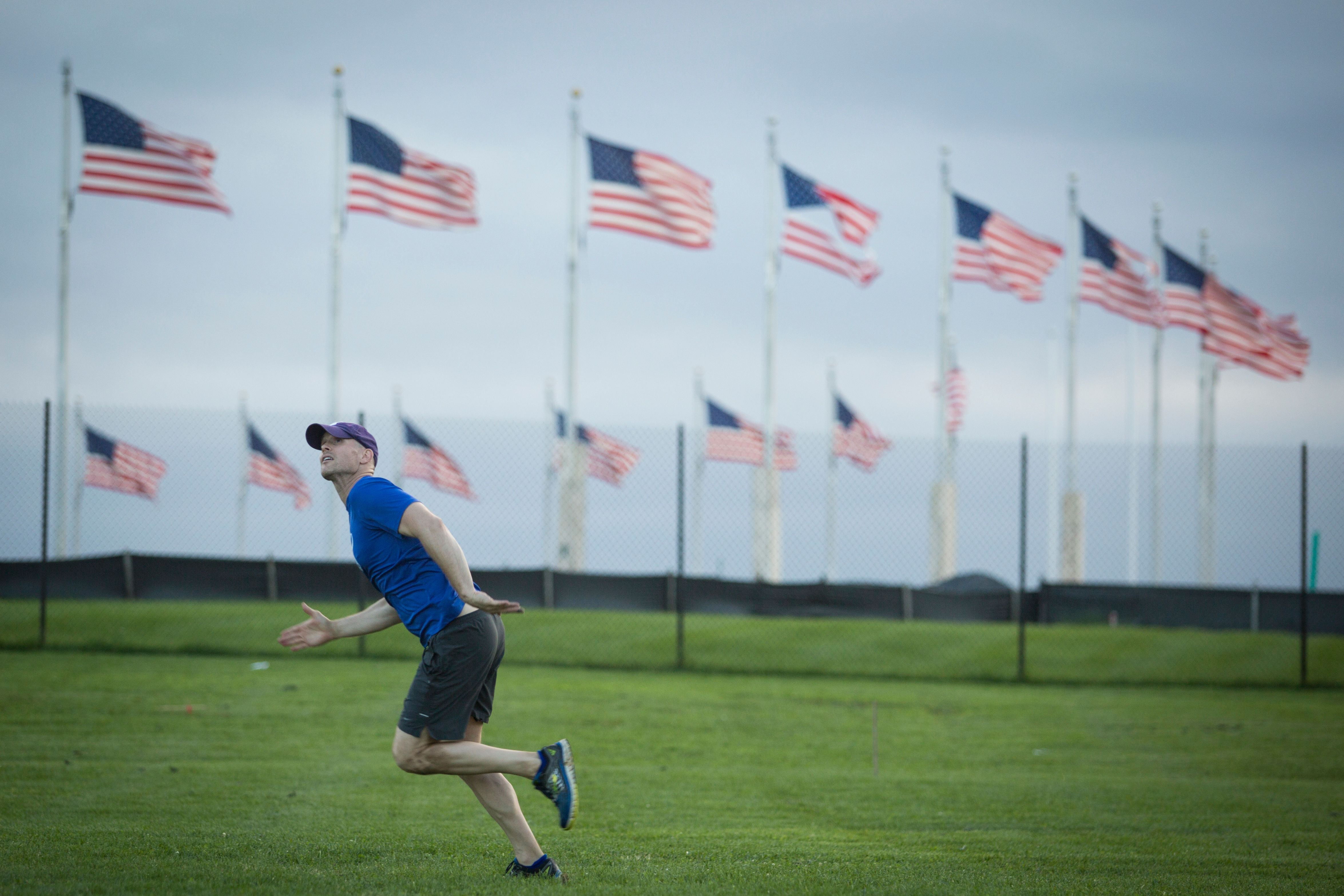 A member of the House softball league runs to second base during the Tax Dodgers versus Immaculate Innings game next to the Washington Monument on Tuesday. (Sarah Silbiger/CQ Roll Call)