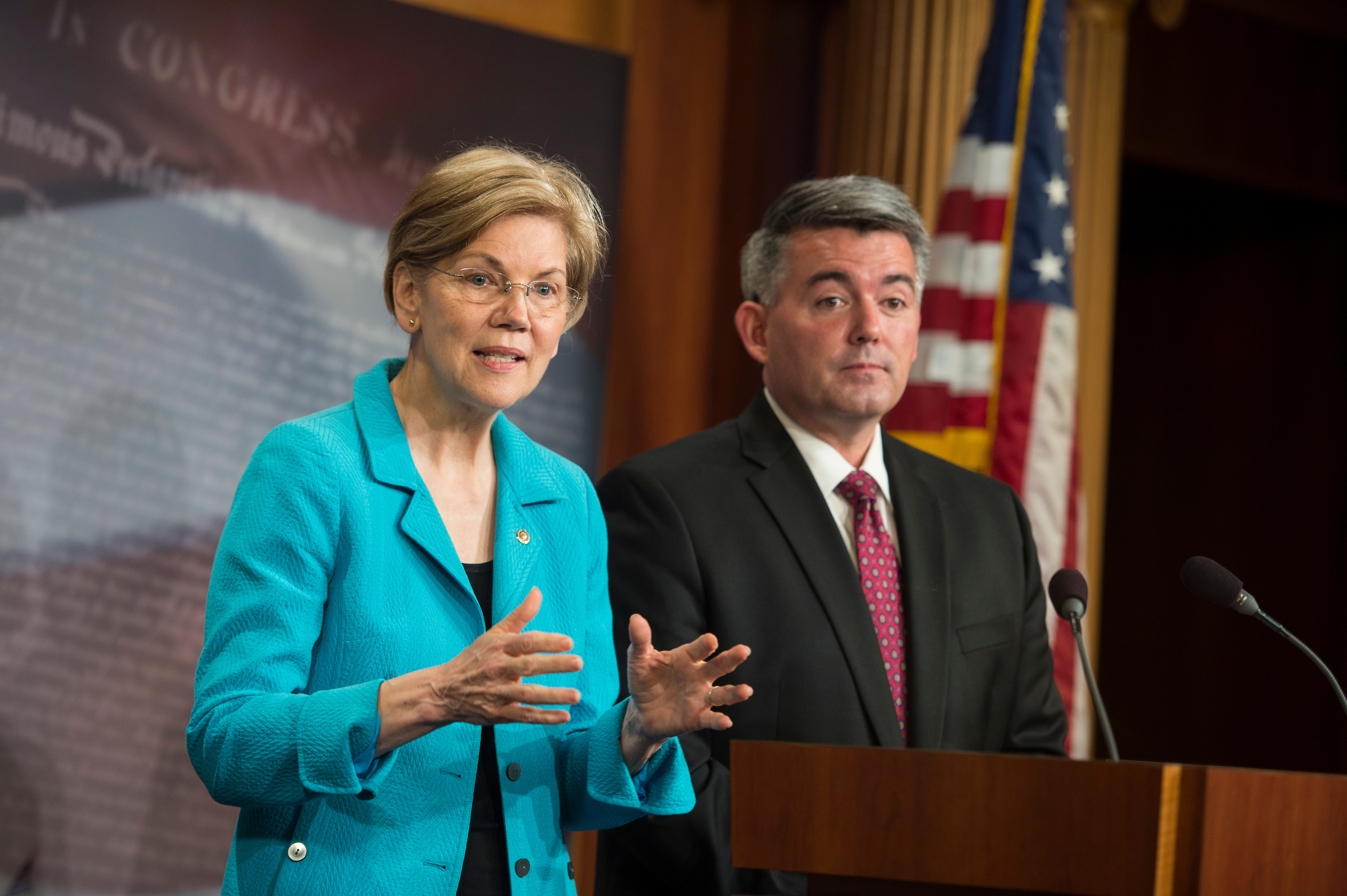 Massachusetts Democratic Sen. Elizabeth Warren and Colorado Republican Sen. Cory Gardner hold a news conference on Thursday to discuss bipartisan action they are taking to put marijuana legislation into the hands of state lawmakers. (Sarah Silbiger/CQ Roll Call)