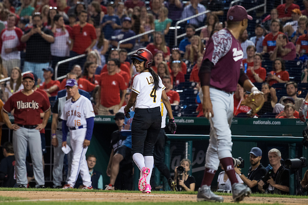 Rep. Mia Love, R-Utah, has a word with Rep. Cedric Richmond, D-La., after he tagged her out at home plate during the 57th annual Congressional Baseball Game at Nationals Park on June 14, 2018. The Democrats prevailed 21-5. (Tom Williams/CQ Roll Call)