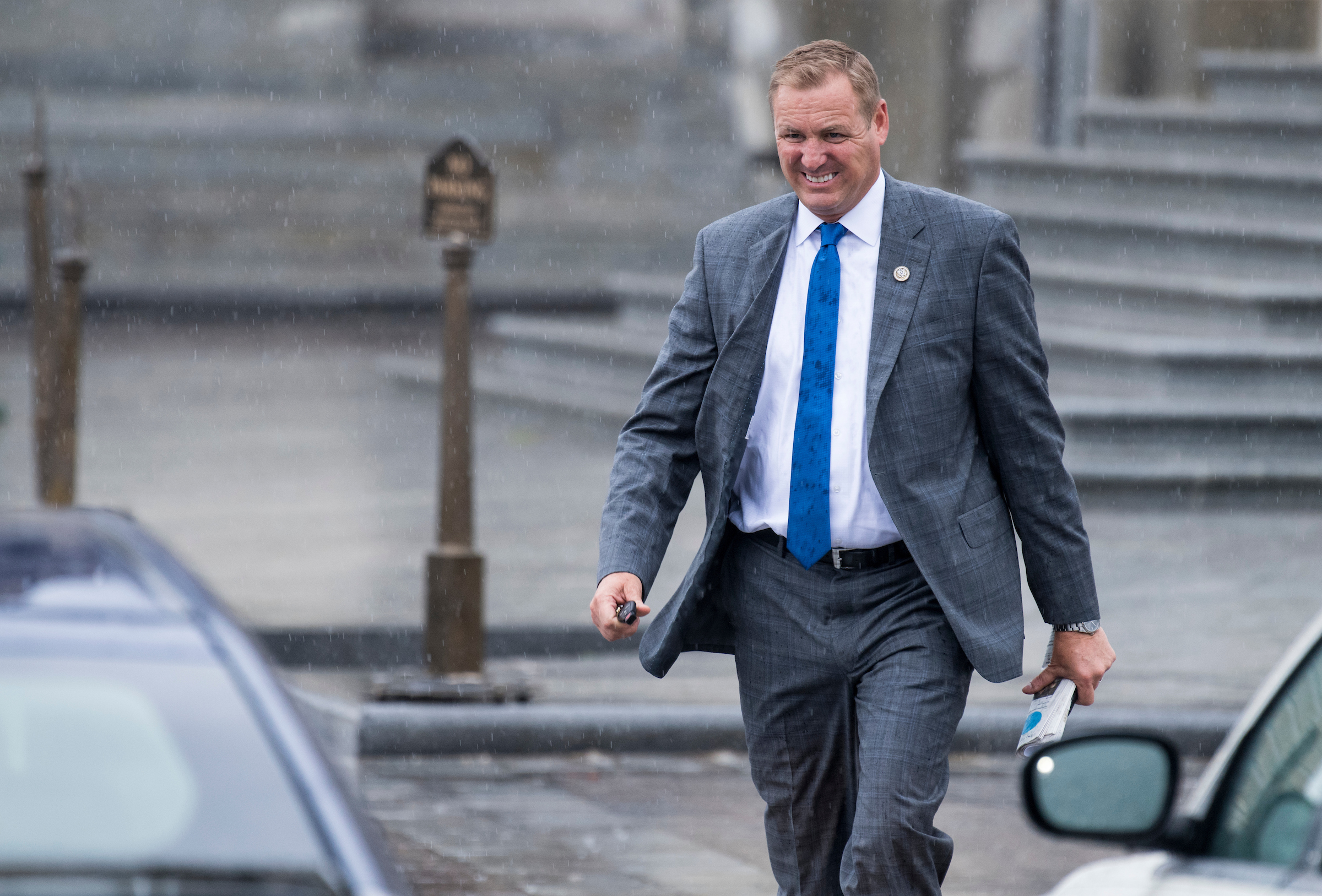 Rep. Jeff Denham, R-Calif., leaves the Capitol in the rain after the final vote of the week on Friday. He plans to spend his weekend continuing negotiations over immigration legislation, striving to reach an agreement on changes before a rescheduled vote next week. (Bill Clark/CQ Roll Call)