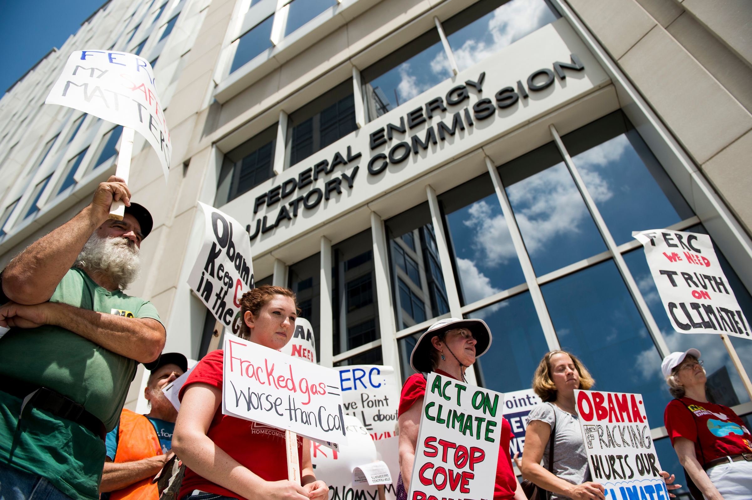 Members of the Chesapeake Climate Action Network picket outside the headquarters of the Federal Energy Regulatory Commission in 2014. In the final years of the Obama administration, environmental groups pressed FERC on emissions. (Bill Clark/CQ Roll Call file photo)