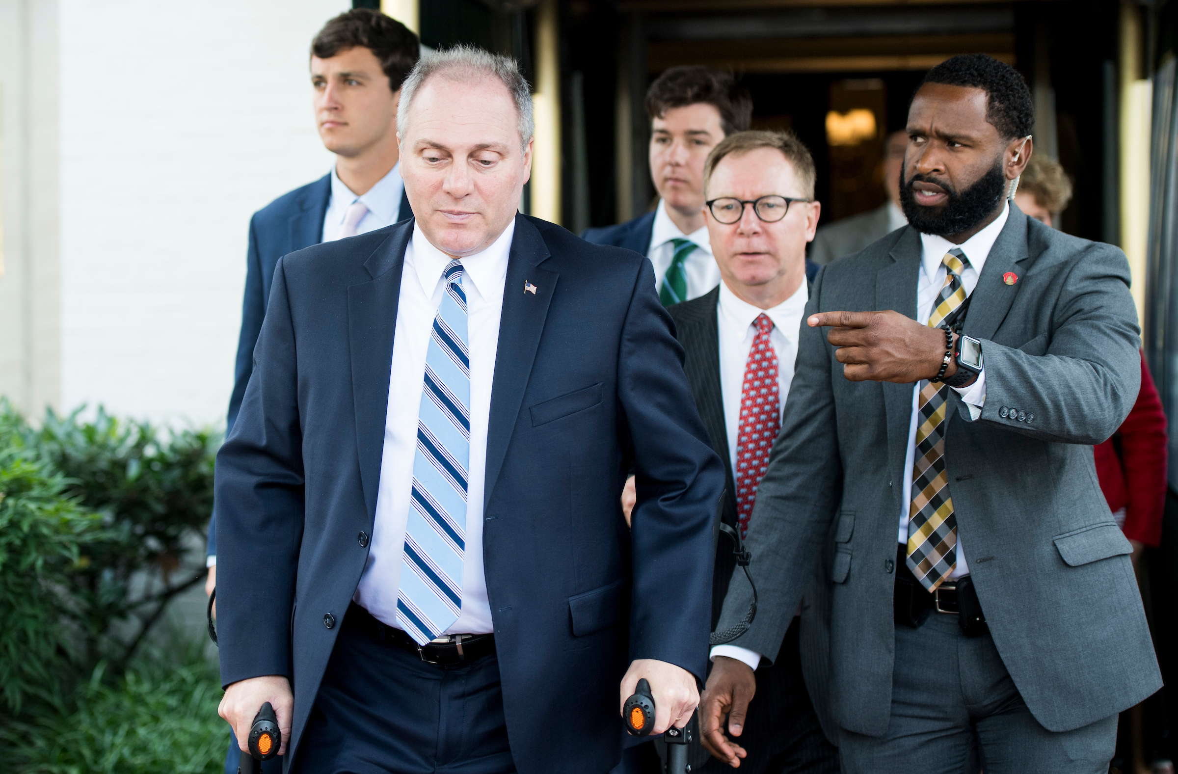 House Majority Whip Steve Scalise, R-La., escorted by U.S. Capitol Police Special Agent David Bailey, leaves the House Republican Conference meeting at the Capitol Hill Club in Washington on Wednesday. Scalise was shot and injured last year at a practice for the Congressional Baseball Game. Bailey was also injured in the attack. Unable to play last year because of his injuries, Scalise will be on the field at Thursday’s game. (Bill Clark/CQ Roll Call)