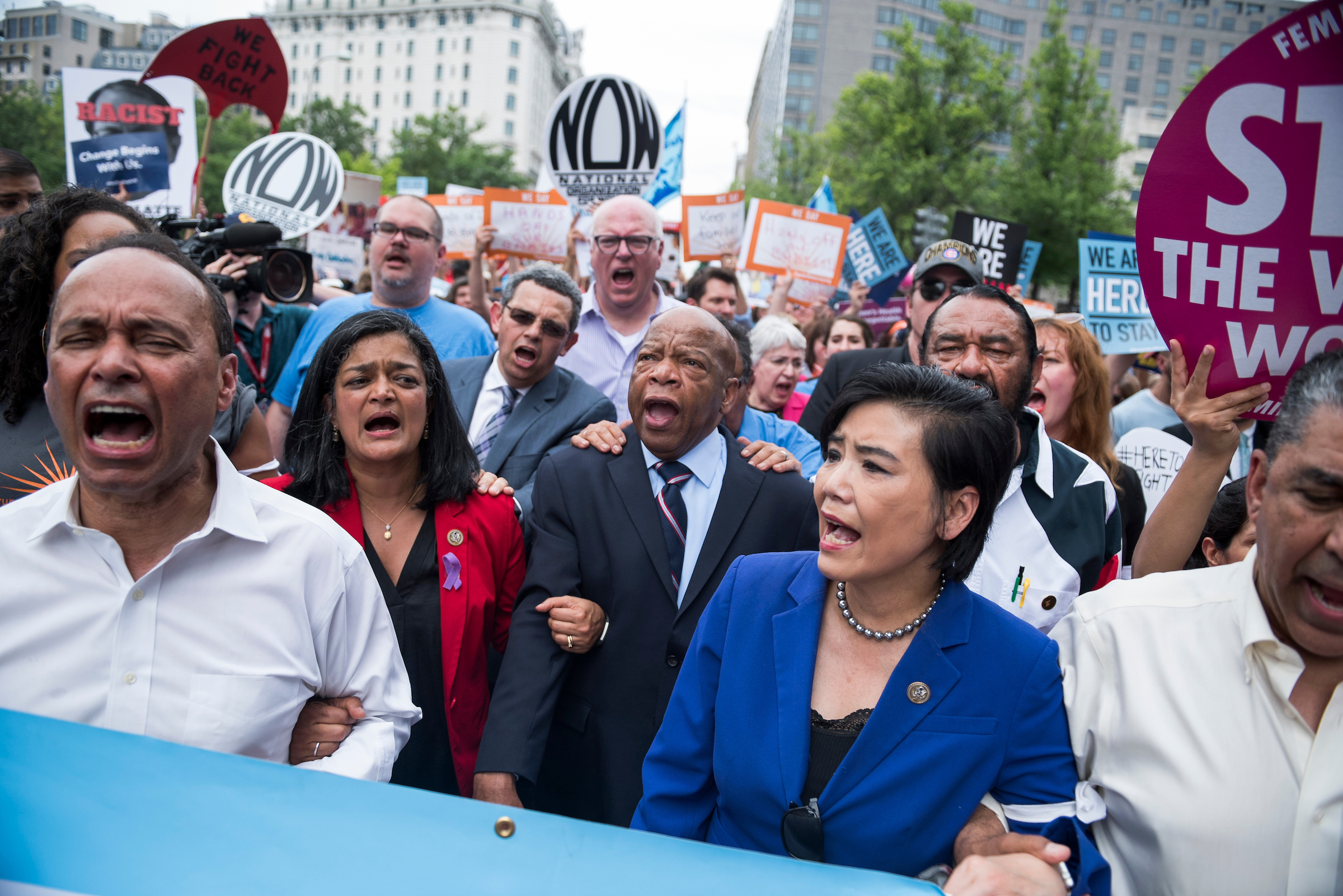 From left, Reps. Luis V. Gutiérrez, D-Ill., Pramila Jayapal, D-Wash., John Lewis, D-Ga., Judy Chu, D-Calif., Al Green, D-Texas, Adriano Espaillat, D-N.Y., and others march in Washington on June 13 to protest the Trump administration’s family separation policy at the southern border. Rep. Joseph Crowley, D-N.Y., appears in the back at center. (Tom Williams/CQ Roll Call file photo)