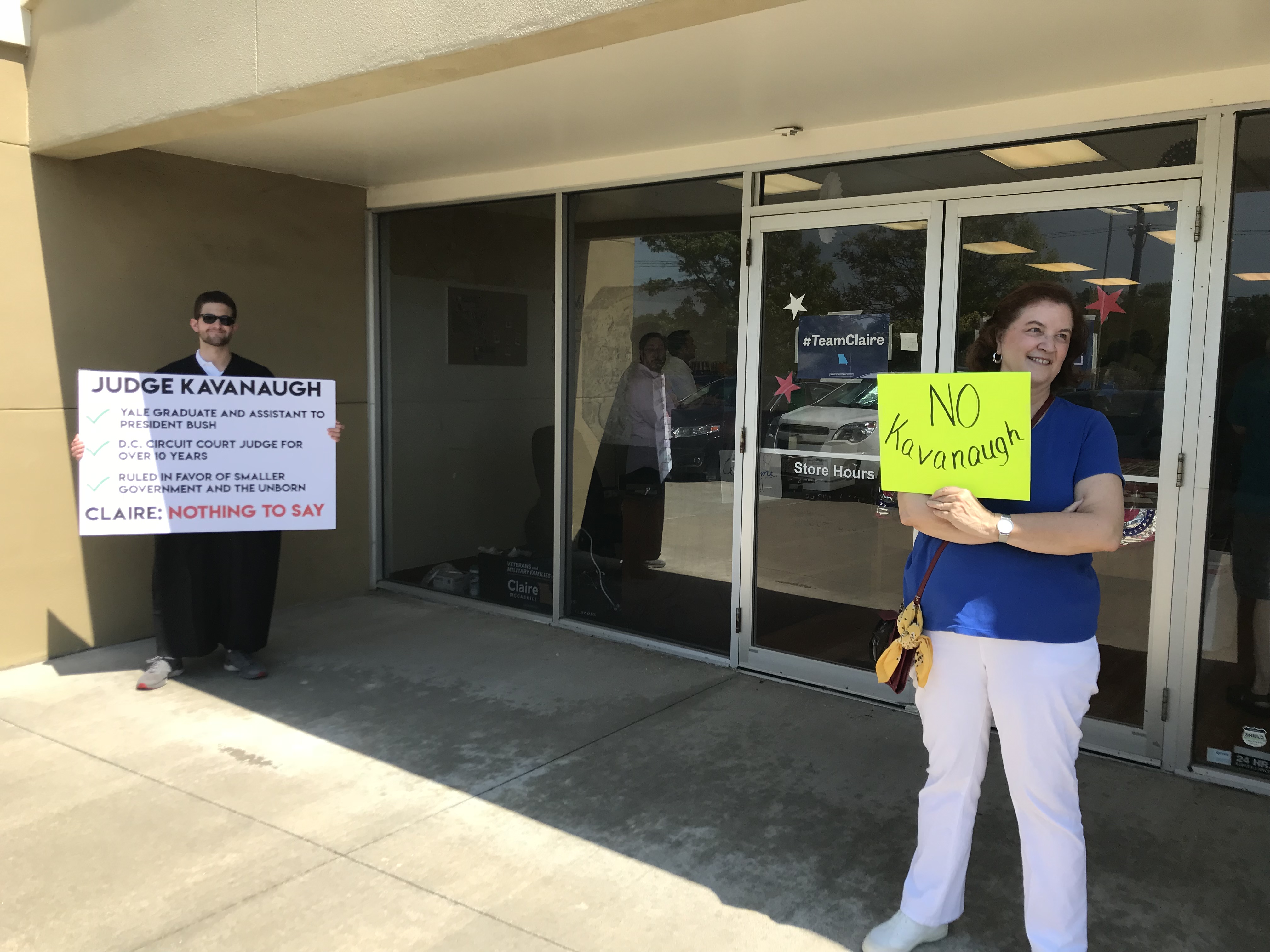 A protester and a volunteer outside of McCaskill's campaign office in Lee's Summit. (Bridget Bowman/CQ Roll Call)
