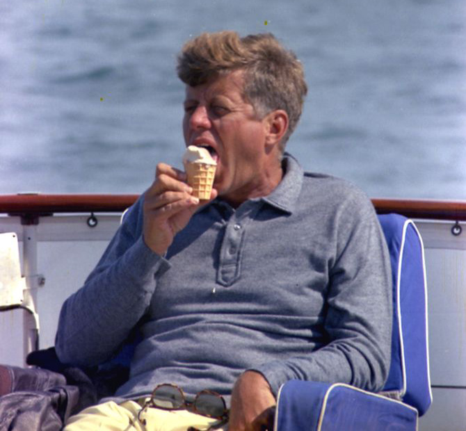 ST-C291-20-63 31 August 1963 President John F. Kennedy eats an ice cream cone aboard the presidential yacht,