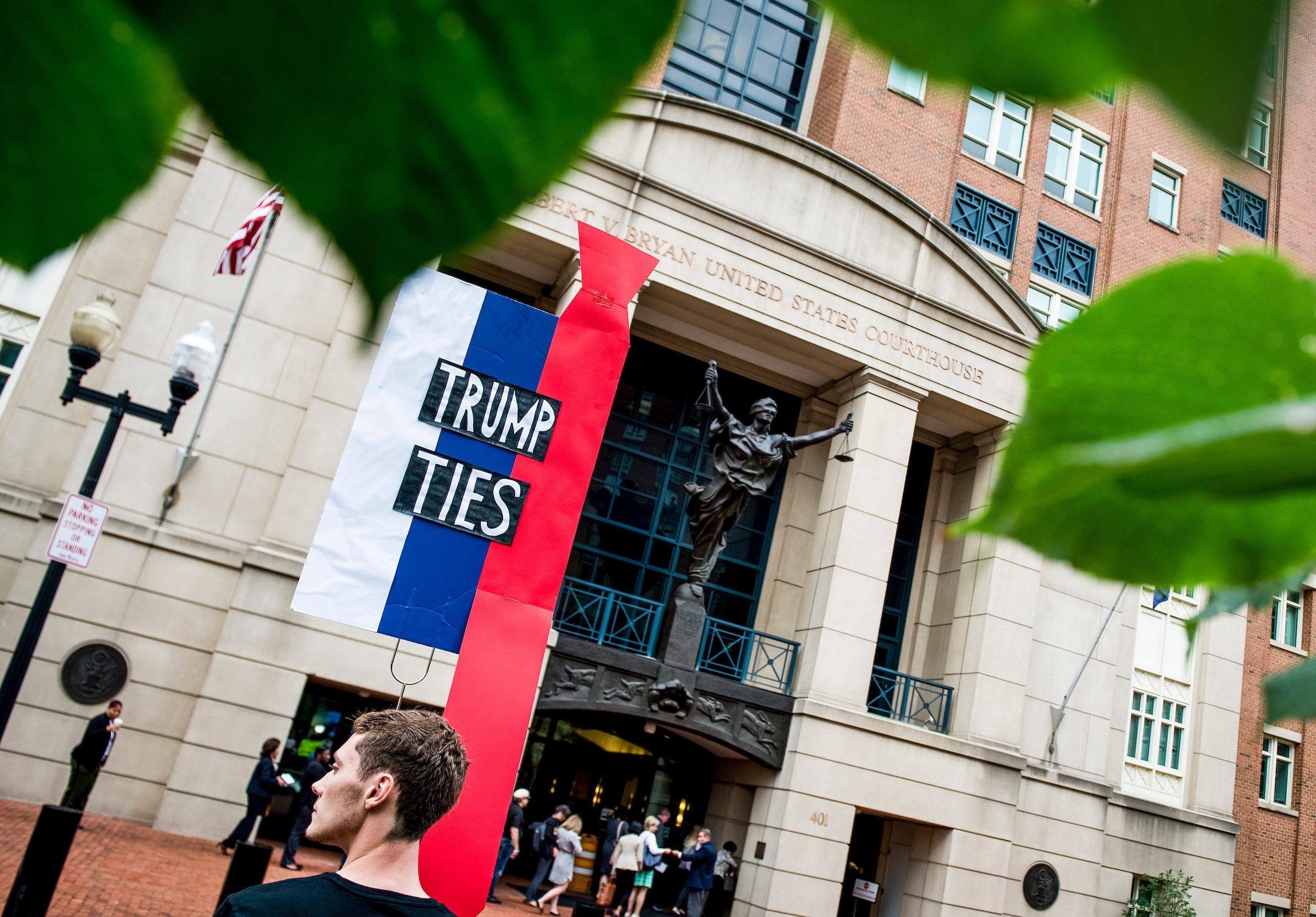 A protester is seen on July 31 outside the United States District Court in Alexandria, Va., where President Donald Trump’s former campaign chairman Paul Manafort is standing trial. (Sarah Silbiger/CQ Roll Call file photo)