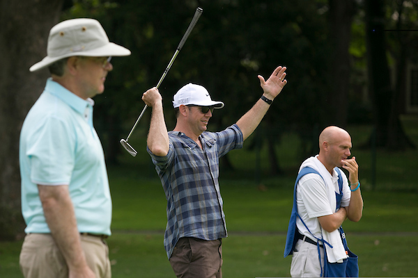 UNITED STATES - JULY 27: Rep. Duncan Hunter, R-Calif. celebrates as his teammates ball goes in the hole as Rep. Jim Cooper, D-Tenn., left, looks on at hole 7 during the First Tee Congressional Challenge golf tournament at the Columbia Country Club in Chevy Chase, Md., on Monday morning, July 27, 2015. (Photo By Al Drago/CQ Roll Call)