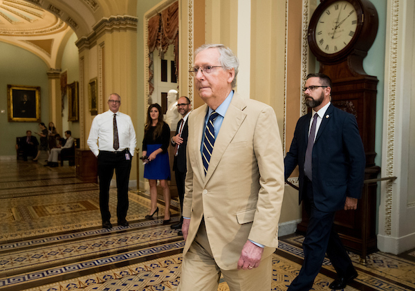 Senate Majority Leader Mitch McConnell, R-Ky., walks to the Senate floor on Thursday for the final vote of the week. (Bill Clark/CQ Roll Call)