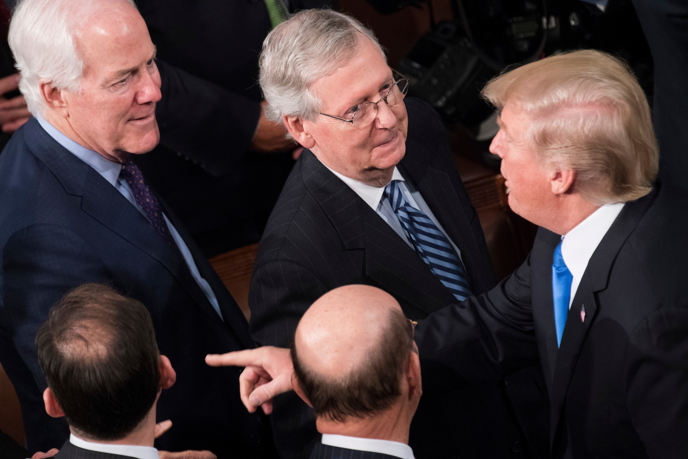 President Donald Trump talks with Senate Majority Leader Mitch McConnell and Majority Whip John Cornyn after his State of the Union address in January. No offense by the president and his administration is so big that it can’t be ignored by Republicans on the Hill, Shapiro writes. (Tom Williams/CQ Roll Call file photo)