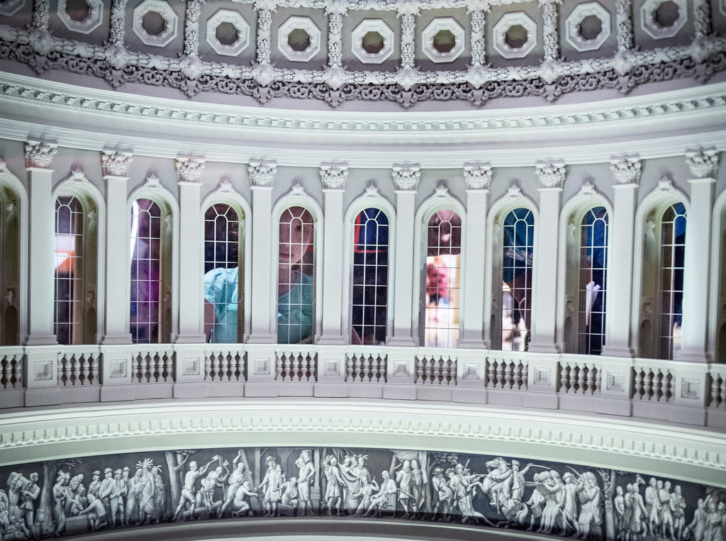 A little girl and a man look through the windows of the Capitol dome miniature model in the Capitol Visitors Center Monday afternoon Sept. 10, 2018. (Sarah Silbiger/CQ Roll Call)