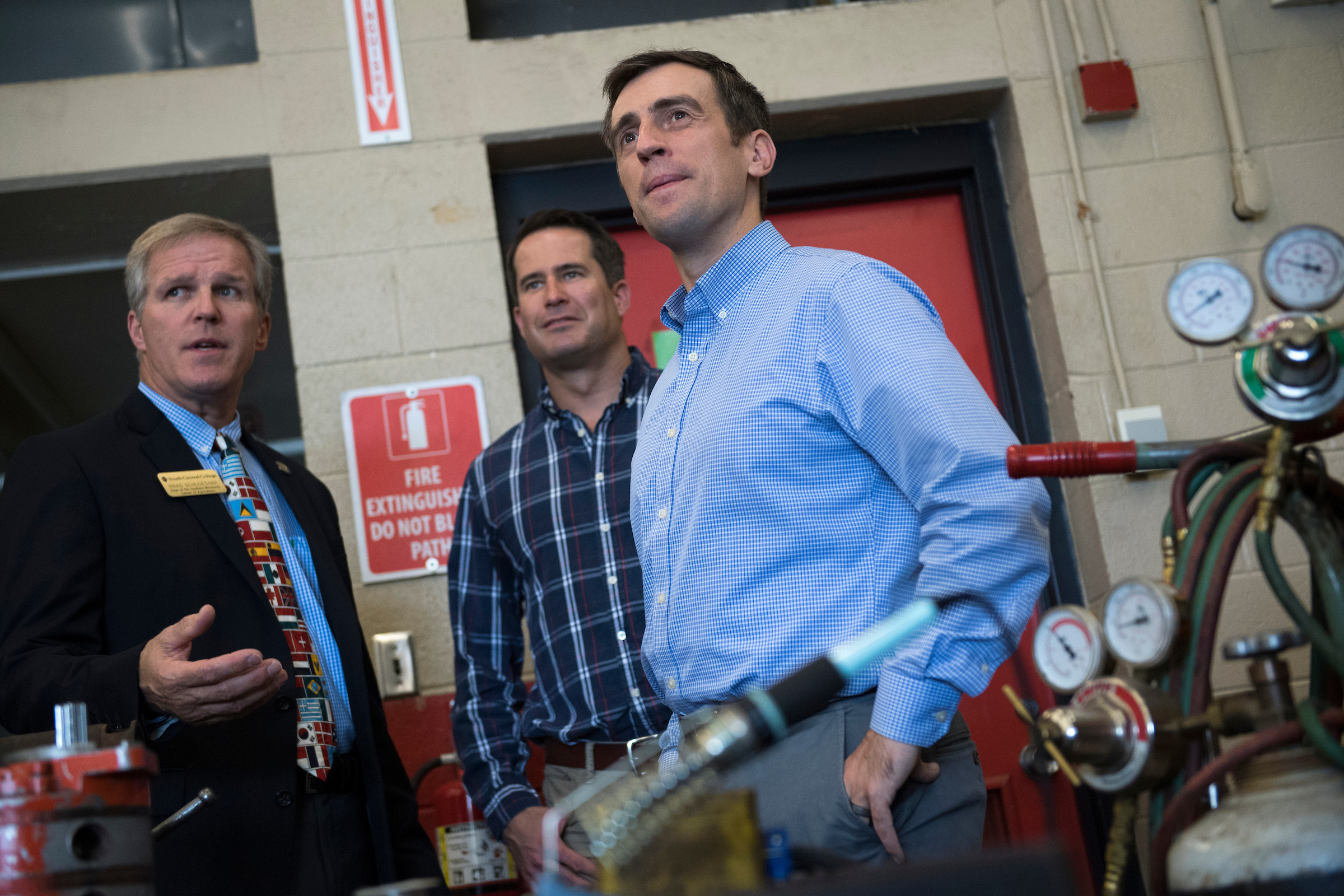 UNITED STATES - SEPTEMBER 19: Dan Feehan, right, Democratic candidate for Minnesota's 1st Congressional District, and Rep. Seth Moulton, D-Mass., center, are given a tour of South Central College by Brad Schloesser, dean of agriculture for the Southern Minnesota Center of Agriculture, in Mankato, Minn., on September 19, 2018. (Photo By Tom Williams/CQ Roll Call)