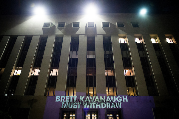 The political protest group UltraViolet projected anti-Brett Kavanaugh messages on the United States Court of Appeals Tuesday Sept. 25, 2018. (Sarah Silbiger/CQ Roll Call) 