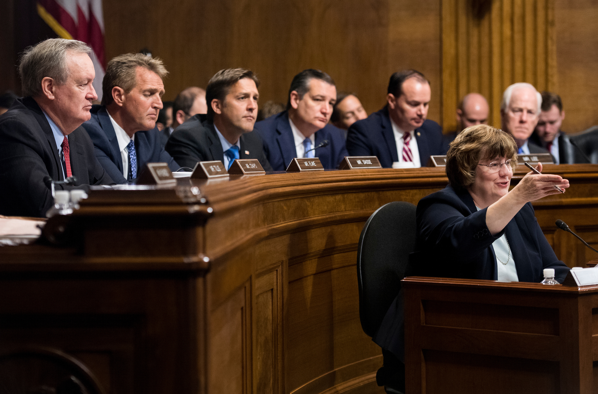 Rachel Mitchell, counsel for Senate Judiciary Committee Republicans, questions Christine Blasey Ford on Thursday as, from left, Sens. Michael D. Crapo, R-Idaho, Jeff Flake, R-Ariz., Ben Sasse, R-Neb., Ted Cruz, R-Texas, Mike Lee, R-Utah., and John Cornyn, R-Texas, listen during the hearing on sexual assault allegations against Supreme Court nominee Brett Kavanaugh. (Tom Williams/CQ Roll Call/POOL)