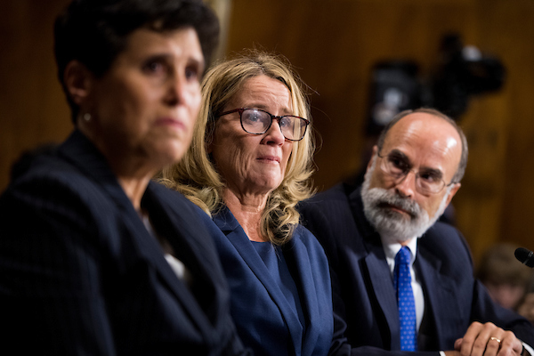 UNITED STATES - SEPTEMBER 27: Christine Blasey Ford, center, flanked by attorneys Debra Katz (L) and Michael Bromwich, testifies during the Senate Judiciary Committee hearing on the nomination of Brett M. Kavanaugh to be an associate justice of the Supreme Court of the United States, focusing on allegations of sexual assault by Kavanaugh against Christine Blasey Ford in the early 1980s. (Photo By Tom Williams/CQ Roll Call/POOL)