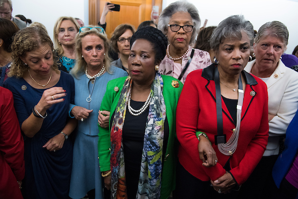 Members of the House of Representatives, who oppose the nomination of the Supreme Court associate justice nominee Brett Kavanaugh, wait to enter the Senate Judiciary Committee vote in Dirksen Senate Office Building on his nomination on September 28, 2018. From left are, Reps. Debbie Wasserman Schultz, D-Fla., Carolyn Maloney, D-N.Y., Debbie Dingell, D-Mich., Suzanne Bonamici, D-Ore., Sheila Jackson Lee, D-Texas, Joyce Beatty, D-Ohio, Brenda Lawrence, D-Mich., and Julia Brownley, D-Calif. (Tom Williams/CQ Roll Call)