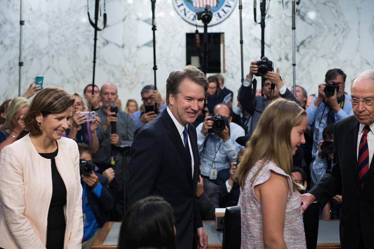 Supreme Court nominee Brett Kavanaugh, arrives for his Senate Judiciary Committee confirmation hearing in Hart Building on Sept. 4. His wife, Ashley, daughter, and Chairman Charles E. Grassley, R-Iowa, also appear. (Photo By Tom Williams/CQ Roll Call)