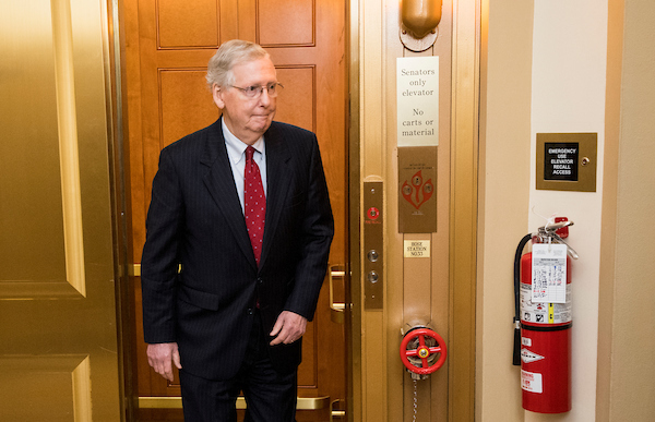 Senate Majority Leader Mitch McConnell, R-Ky., exits the senators-only elevator as he arrives in the Capitol on Monday. (Bill Clark/CQ Roll Call)