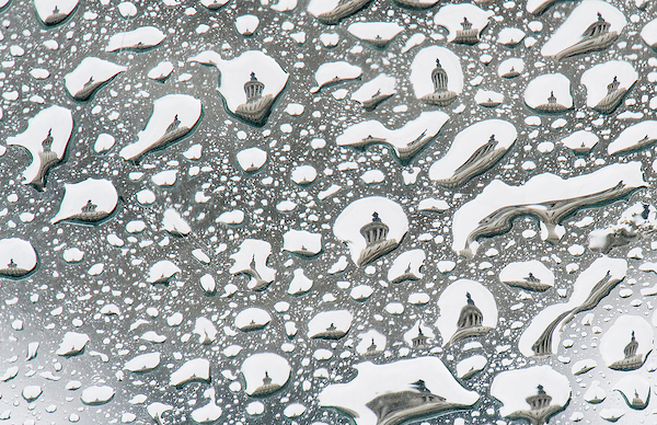 UNITED STATES - SEPTEMBER 24: The U.S. Capitol dome is seen through rain drops pooled on the skylight to the Capitol Visitor Center on Monday, Sept. 24, 2018. (Photo By Bill Clark/CQ Roll Call)