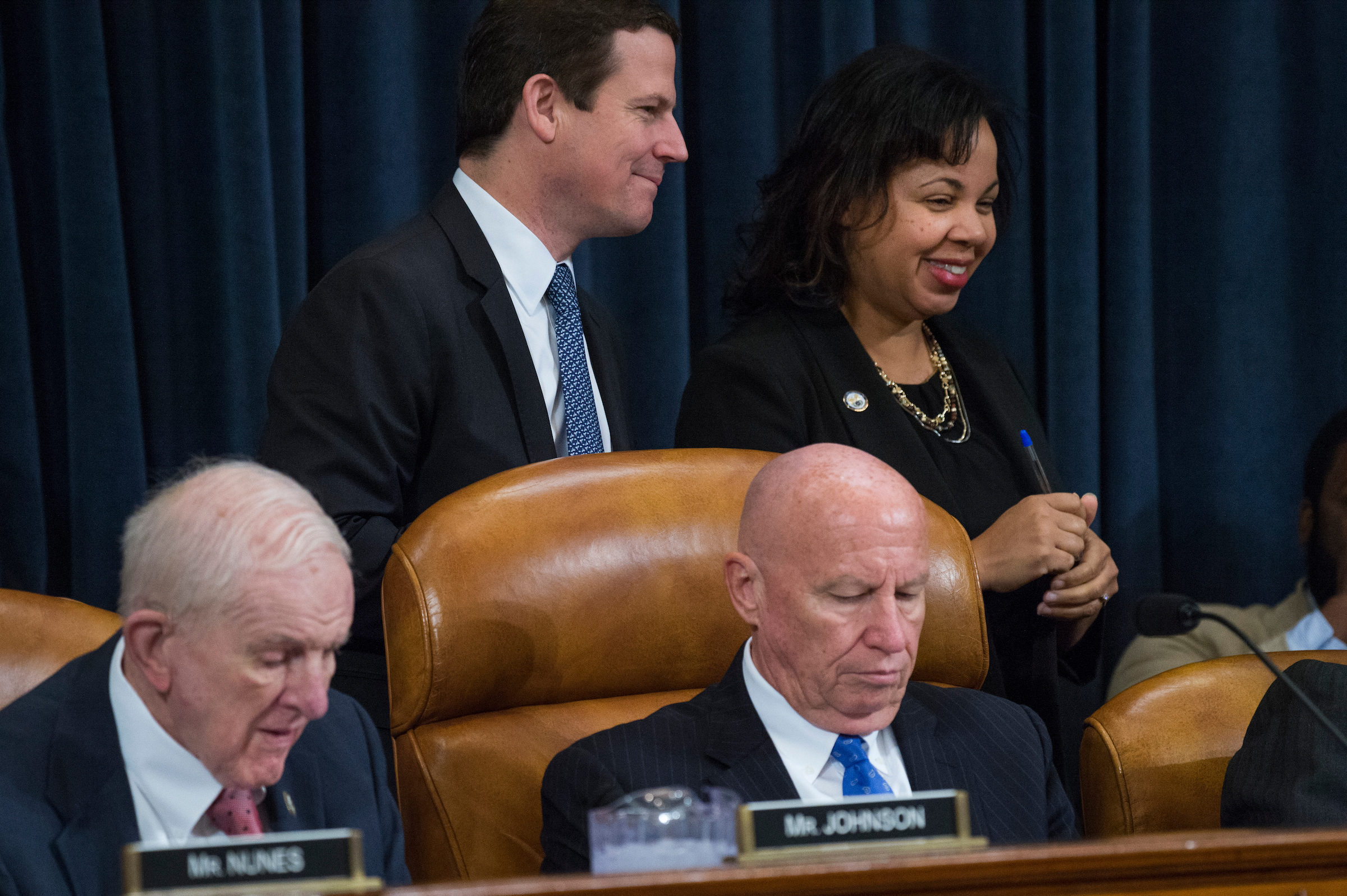 House Ways and Means Chairman Kevin Brady, right, and Texas Rep. Sam Johnson during a markup of the GOP tax bill in November. In the background, David Stewart, the panel’s majority staff director at the time, and Karen McAfee, the minority staff director. The Ways and Means Committee was the first one in the House to receive staff. (Tom Williams/CQ Roll Call file photo)