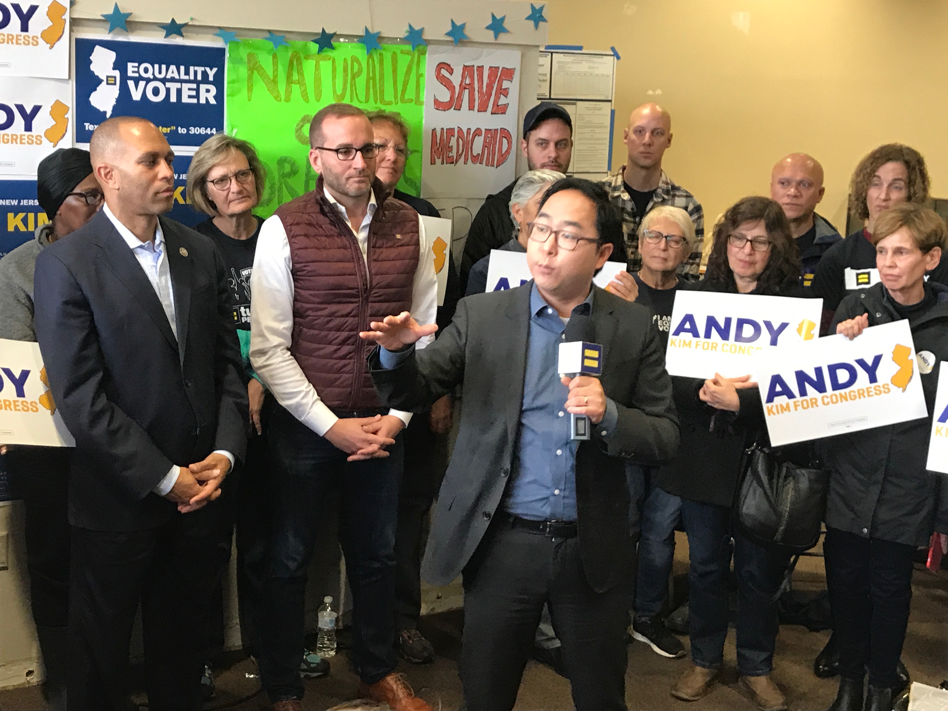 Democrat Andy Kim, center, campaigns for New Jersey's 3rd District with New York Rep. Hakeem Jeffries, far left, and Human Rights Campaign president Chad Griffin, second from left, in Willingboro, New Jersey. (Simone Pathe/CQ Roll Call)