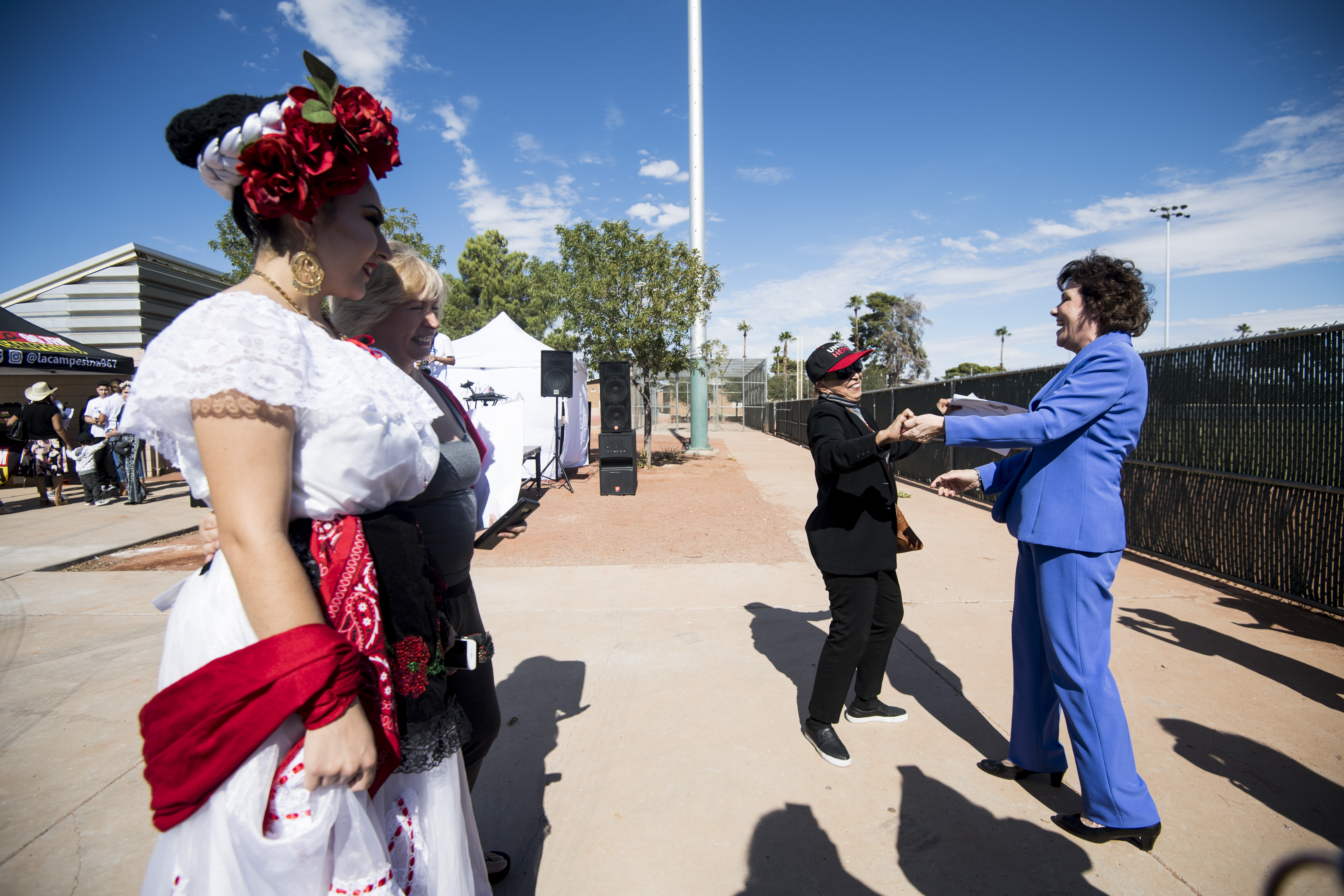 UNITED STATES - OCTOBER 20: Rep. Jacky Rosen, D-Nev., Democratic candidate for U.S. Senate, dances with a supporter at the East Las Vegas Community Center, an early voting location, in Las Vegas on Saturday, Oct. 20, 2018, the first day of early voting in Nevada. (Photo By Bill Clark/CQ Roll Call)