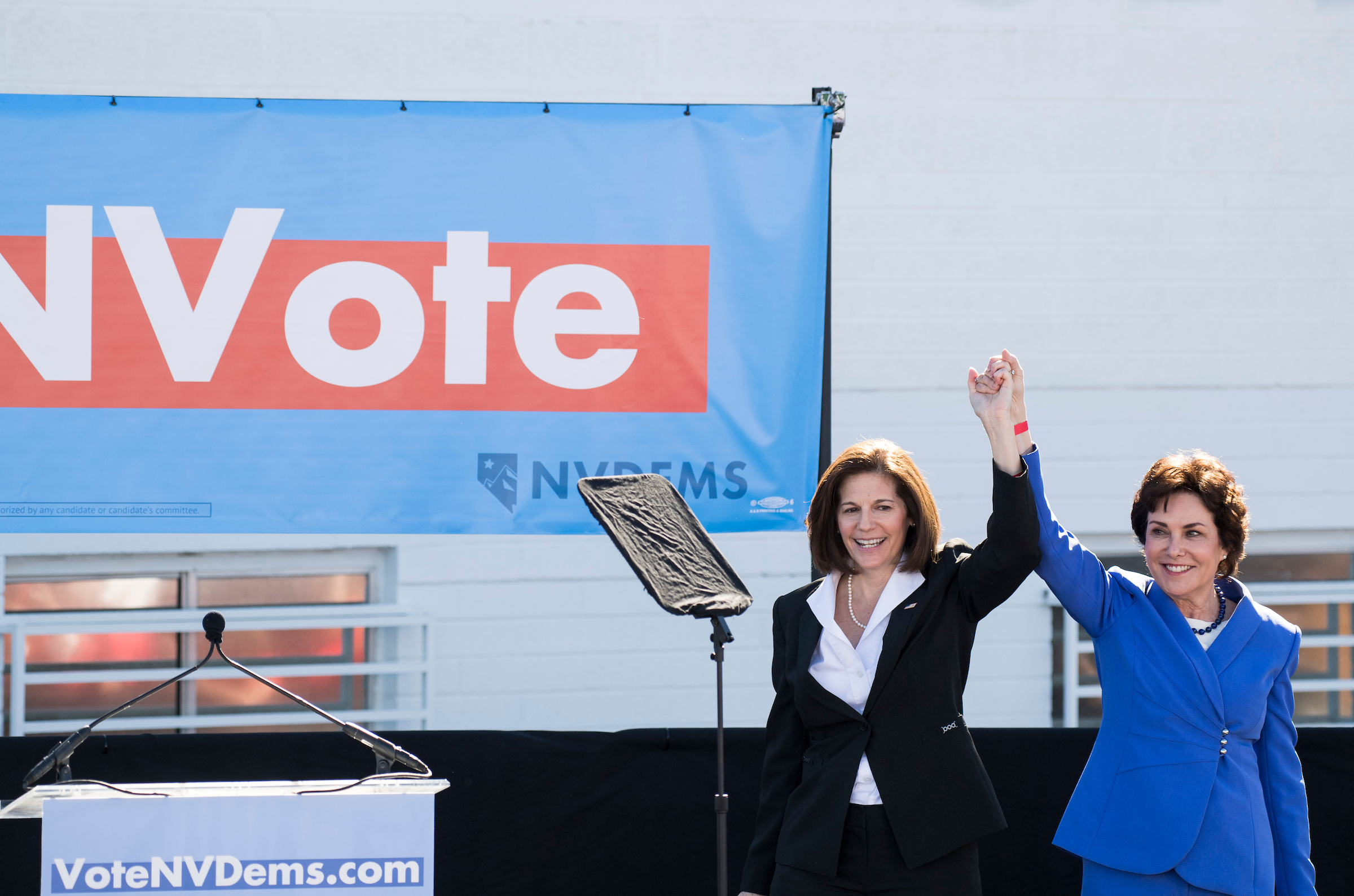 Sen. Catherine Cortez Masto, D-Nev., left, and Democratic candidate for Senate Rep. Jacky Rosen, D-Nev.,hold hands up in the air at the Nevada Democrats' early vote rally, which featured former Vice President Joe Biden, at the Culinary Workers Union Local 226 in Las Vegas on Saturday, Oct. 20, 2018, the first day of early voting in Nevada. (Photo By Bill Clark/CQ Roll Call)